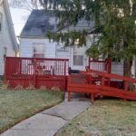 House with red porch and ramp entrance.