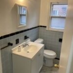 Small bathroom with sink and toilet.