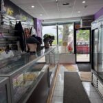 Clothing store interior with glass display cases.