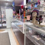 Store interior with hats and display counters.